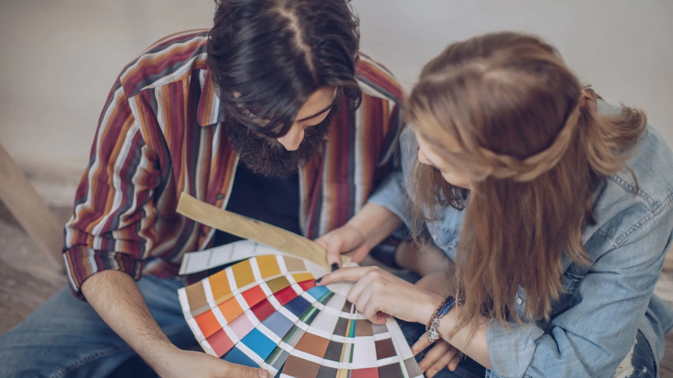 Collaborative color selection with swatches, showcasing creativity and teamwork in a design project.