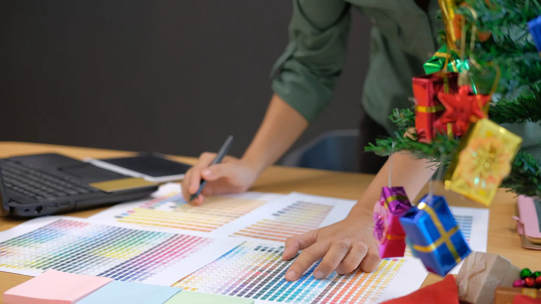 Creative workspace blending color design with festive holiday cheer.